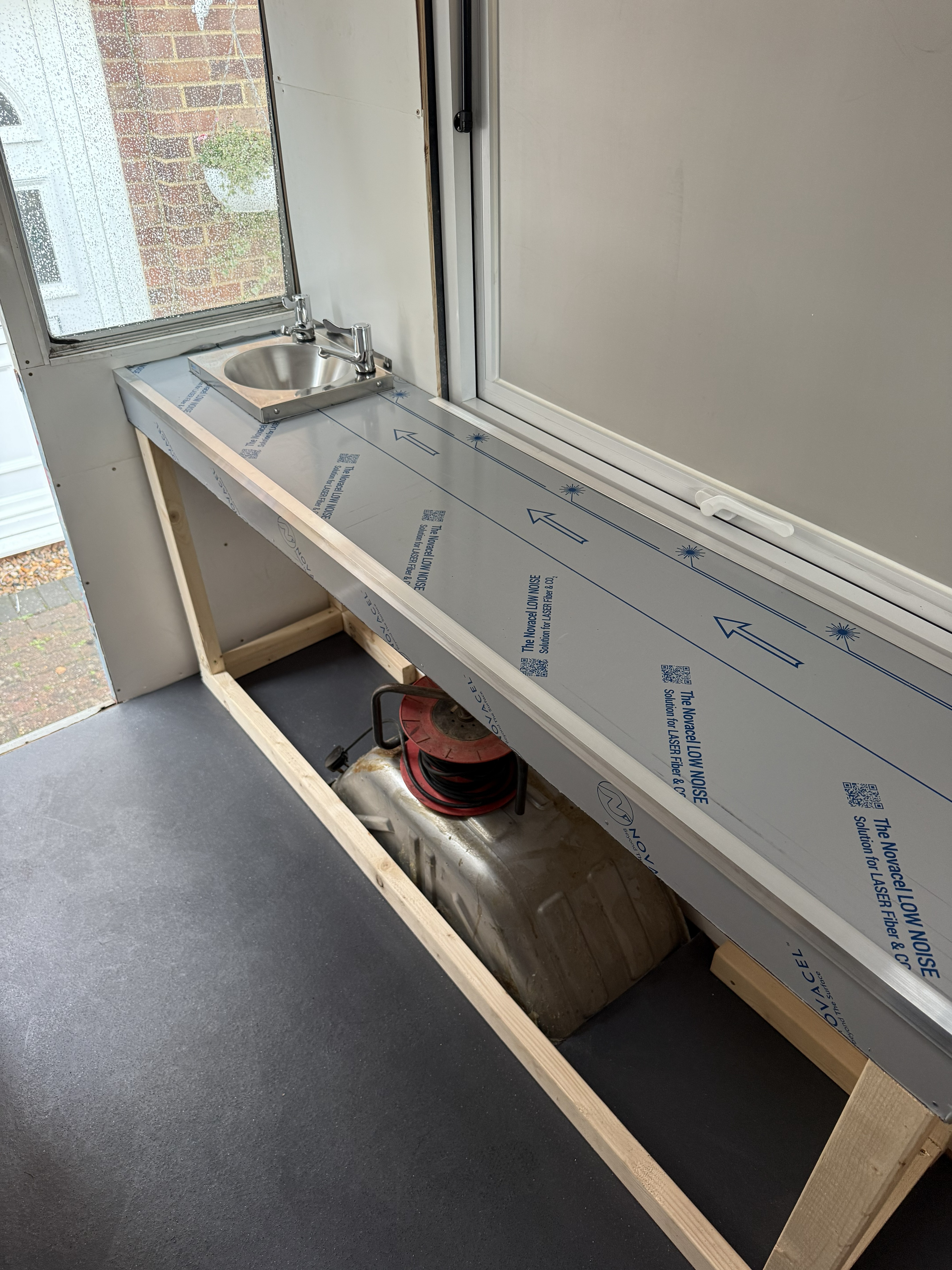 Stainless steel worktop around the kitchen area